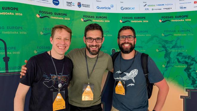 Felix, Daniel and me in front of the FOSS4G Europe Timișoara 2026 photo wall